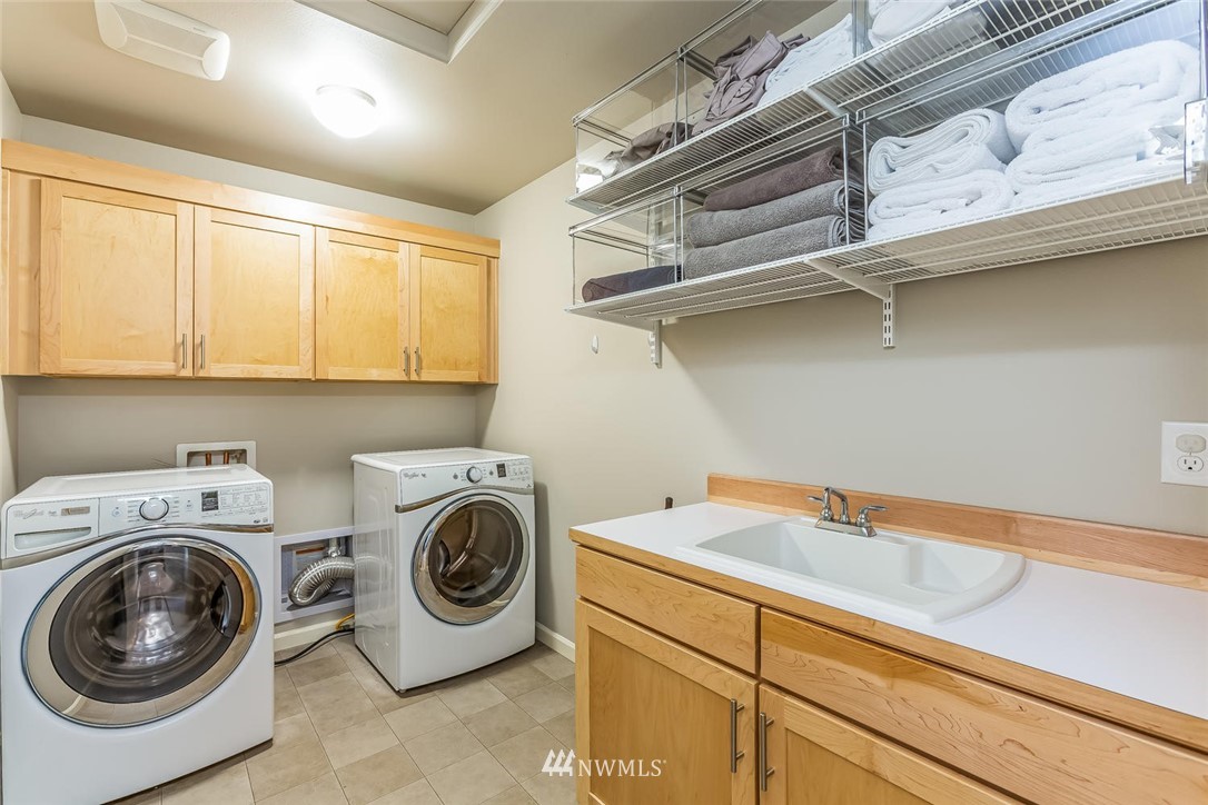 5638 Northeast 9th Street Renton, WA 98059 - Photo 29 of 40 a utility room with dryer and washer