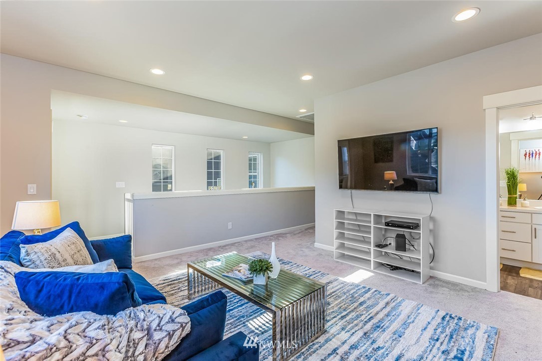 5638 Northeast 9th Street Renton, WA 98059 - Photo 30 of 40 a living room with furniture and a flat screen tv
