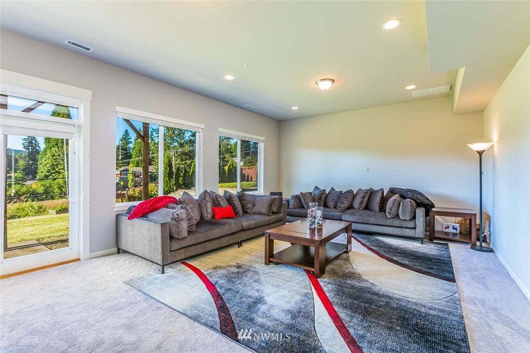 5638 Northeast 9th Street Renton, WA 98059 - Photo 32 of 40 a living room with furniture and a potted plant
