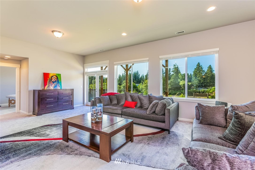 5638 Northeast 9th Street Renton, WA 98059 - Photo 33 of 40 a living room with furniture and a large window