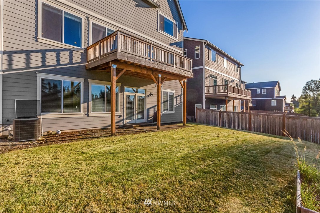 5638 Northeast 9th Street Renton, WA 98059 - Photo 37 of 40 a backyard of a house with barbeque oven table and chairs