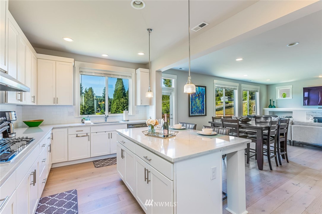 5638 Northeast 9th Street Renton, WA 98059 - Photo 7 of 40 a kitchen with sink stove and cabinets