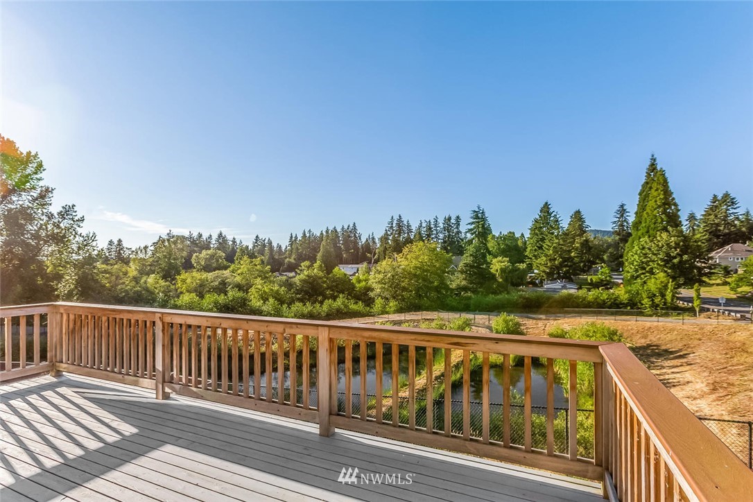 5638 Northeast 9th Street Renton, WA 98059 - Photo 8 of 40 a view of a balcony with wooden floor and fence