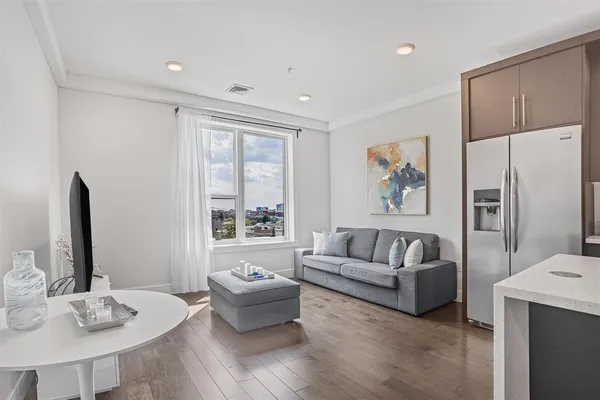 a kitchen with stainless steel appliances granite countertop a refrigerator oven a stove and a refrigerator