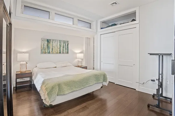 a bedroom with a bed and a table