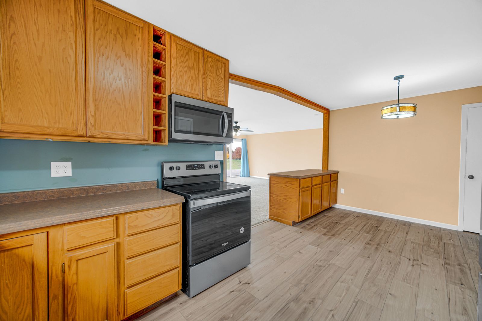 7427 McCurry Road Roscoe, IL 61073 - Photo 11 of 23 a kitchen with stainless steel appliances granite countertop a stove a sink and a microwave