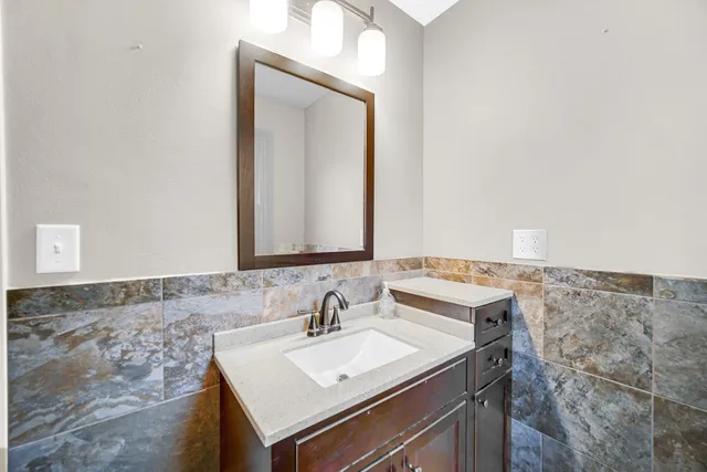 a bathroom with a sink and a mirror