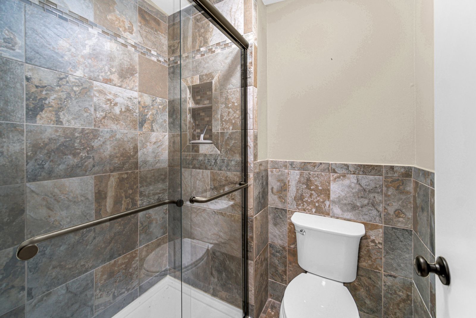 7427 McCurry Road Roscoe, IL 61073 - Photo 15 of 23 a bathroom with a toilet and a shower