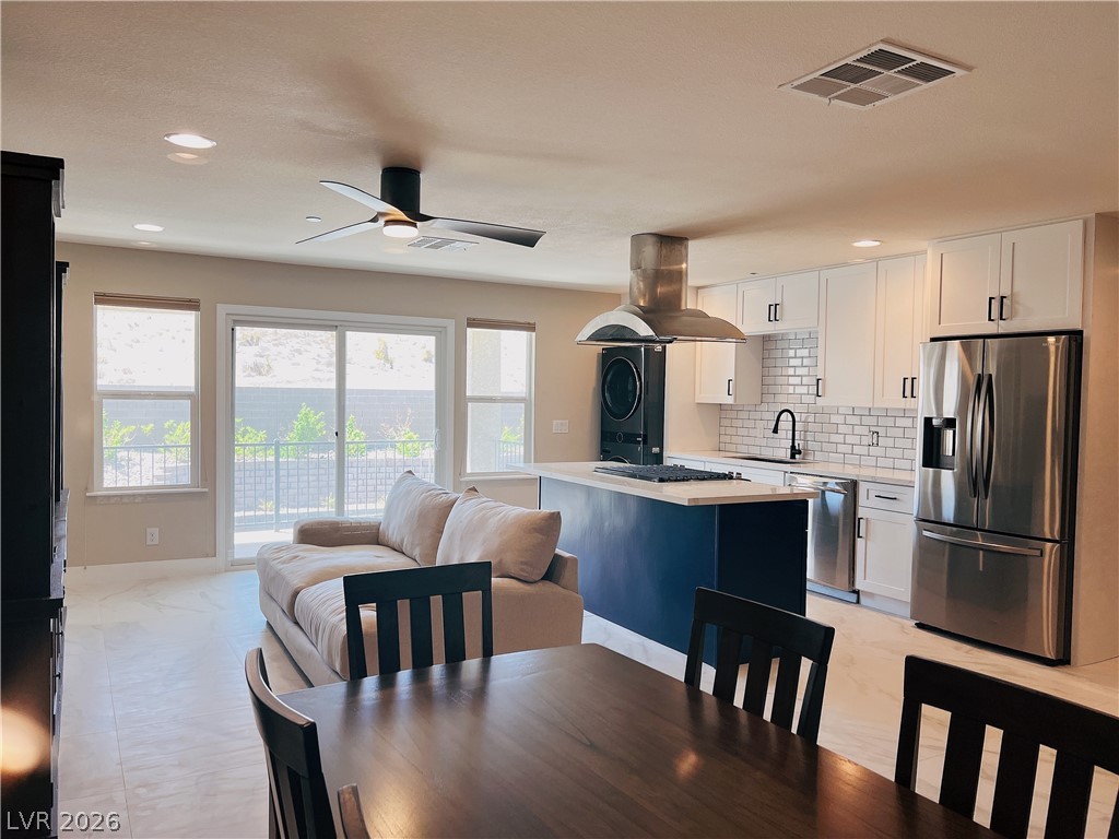 4631 Amazing View Street Las Vegas, NV 89129 - Photo 32 of 33 An open-concept living space integrates a stylish kitchen with modern appointments, offering seamless indoor-outdoor living.