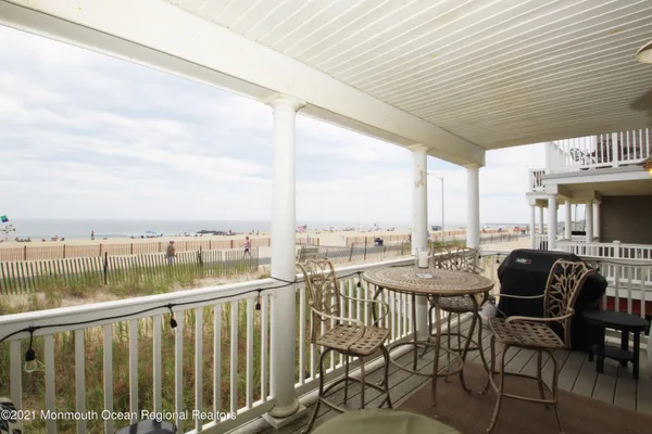 a view of a balcony with chairs
