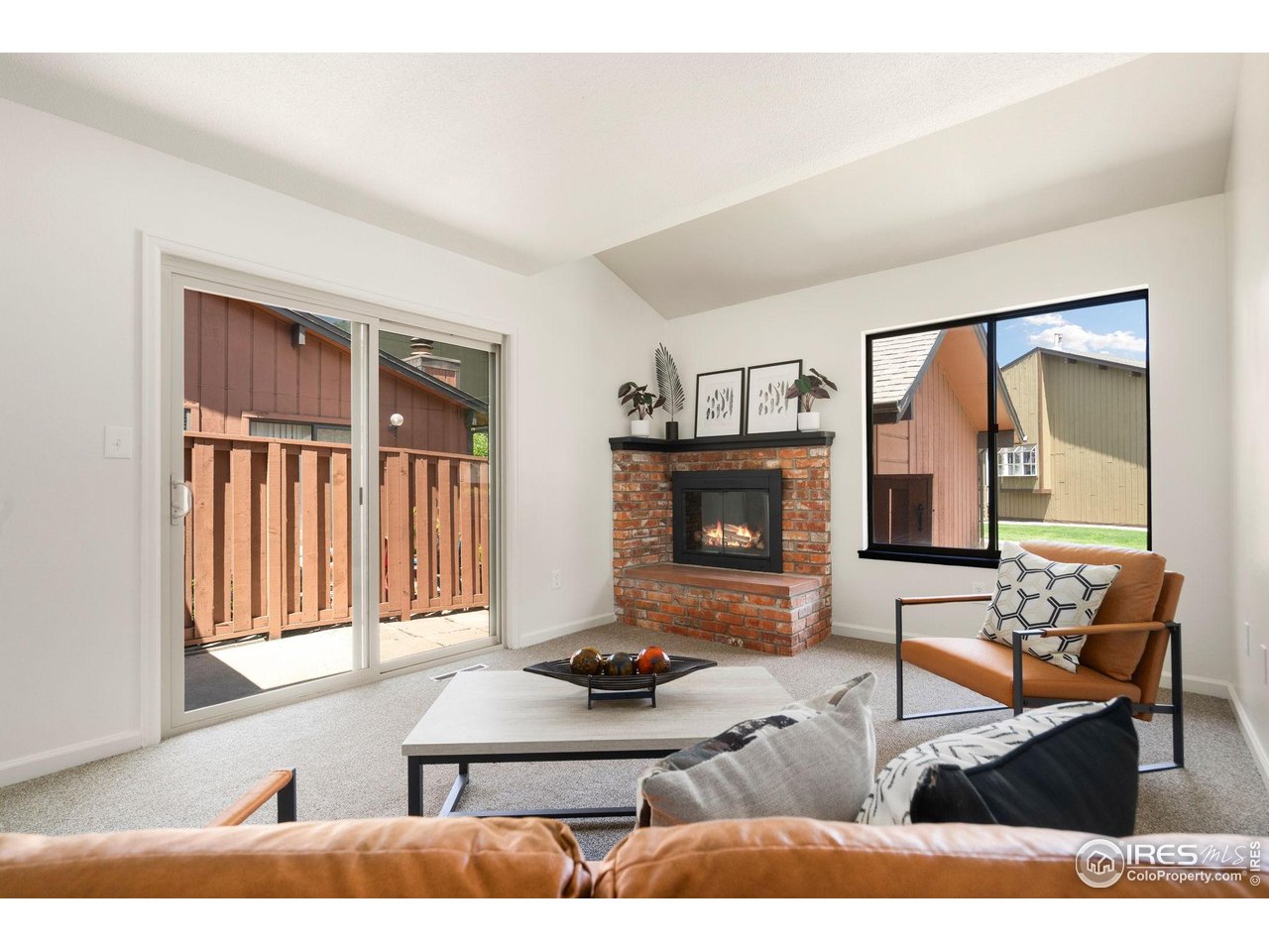 1935 Waters Edge Street, Unit F Fort Collins, CO 80526 - Photo 4 of 23 Living Room with Access to gated front patio