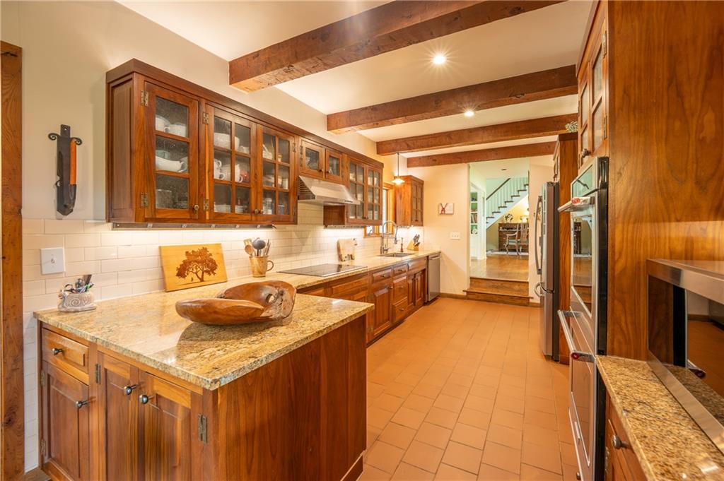 127 Mountain Road Ligonier, PA 15658 - Photo 12 of 45 a kitchen with a sink and a refrigerator