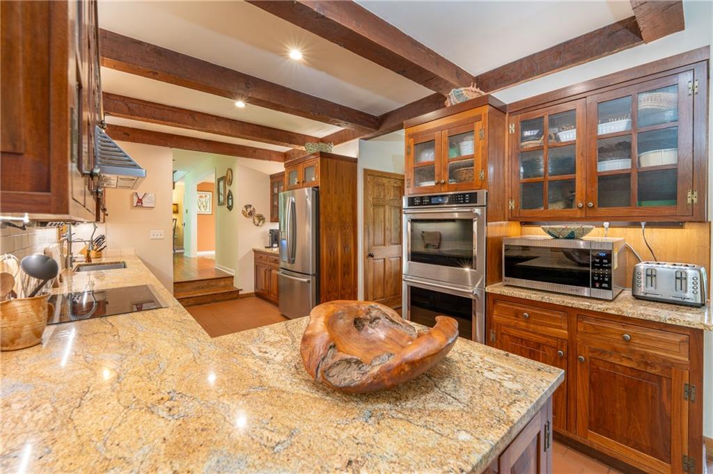 127 Mountain Road Ligonier, PA 15658 - Photo 13 of 45 a kitchen with a sink and a stove top oven