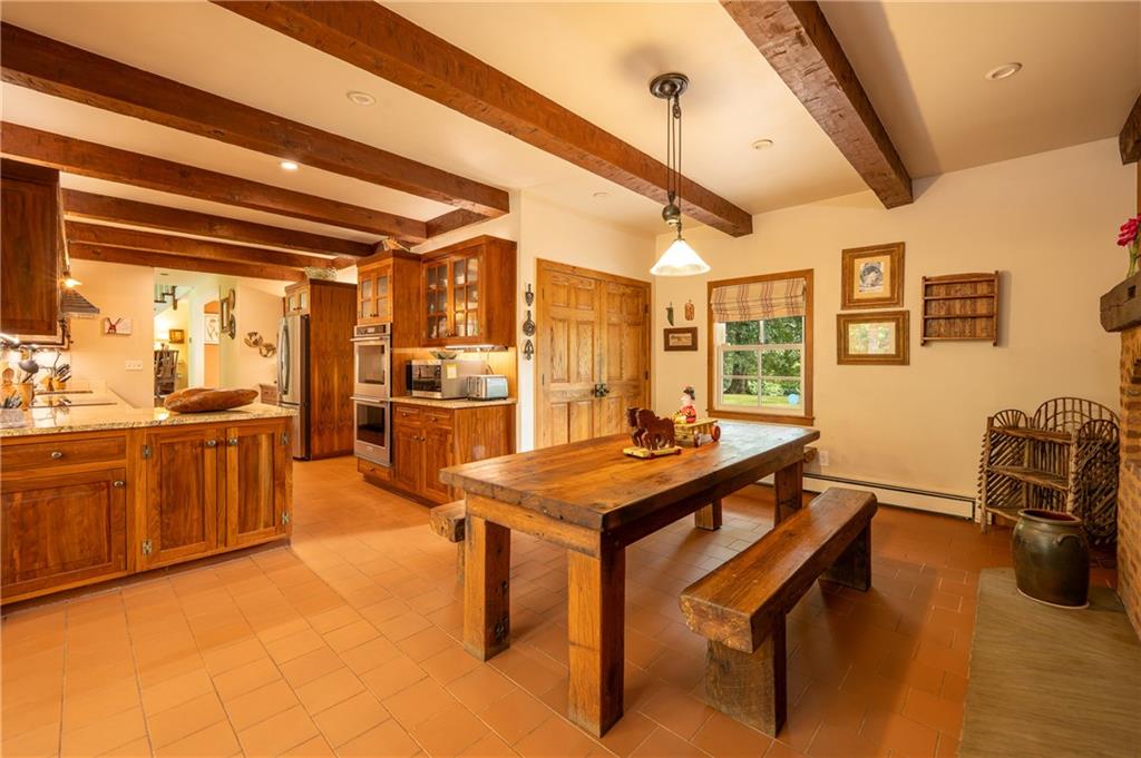 127 Mountain Road Ligonier, PA 15658 - Photo 15 of 45 a room with stainless steel appliances kitchen island granite countertop furniture and a kitchen view