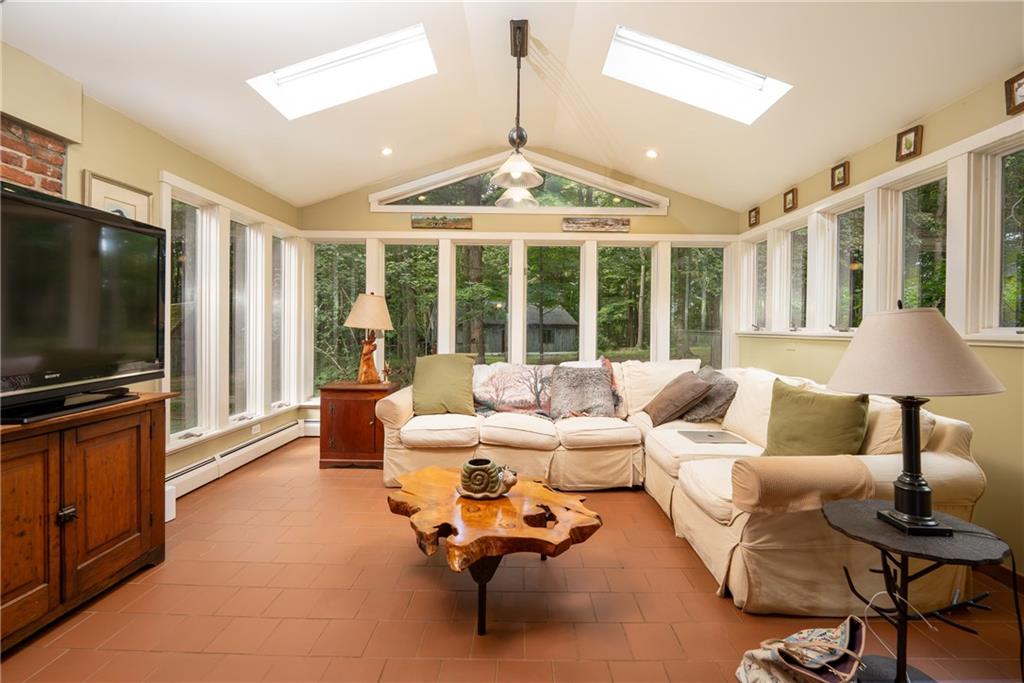 127 Mountain Road Ligonier, PA 15658 - Photo 16 of 45 a living room with furniture and a flat screen tv