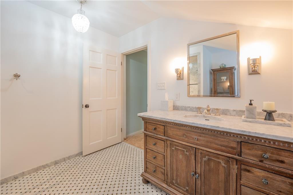 127 Mountain Road Ligonier, PA 15658 - Photo 20 of 45 a bathroom with a sink a vanity and a mirror