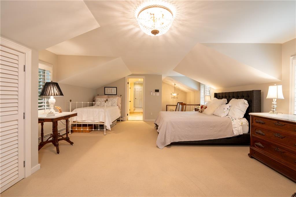 127 Mountain Road Ligonier, PA 15658 - Photo 22 of 45 a bedroom with bed and a chandelier