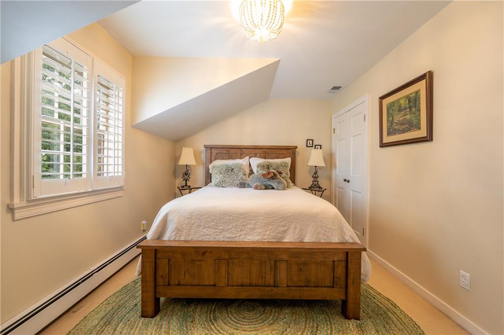 127 Mountain Road Ligonier, PA 15658 - Photo 26 of 45 a bed sitting in a bedroom next to a window