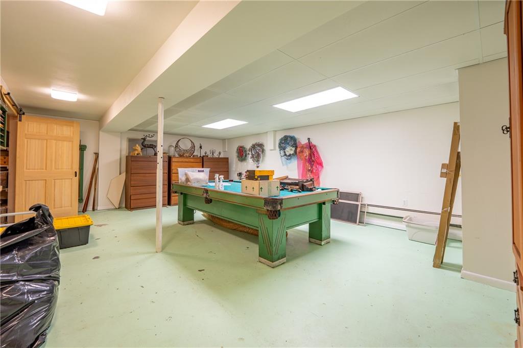 127 Mountain Road Ligonier, PA 15658 - Photo 30 of 45 a room with furniture and a flat screen tv