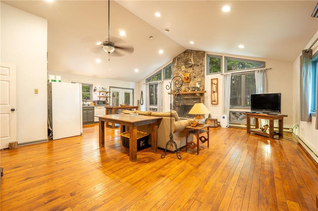 127 Mountain Road Ligonier, PA 15658 - Photo 33 of 45 a living room with lots of furniture table and chairs