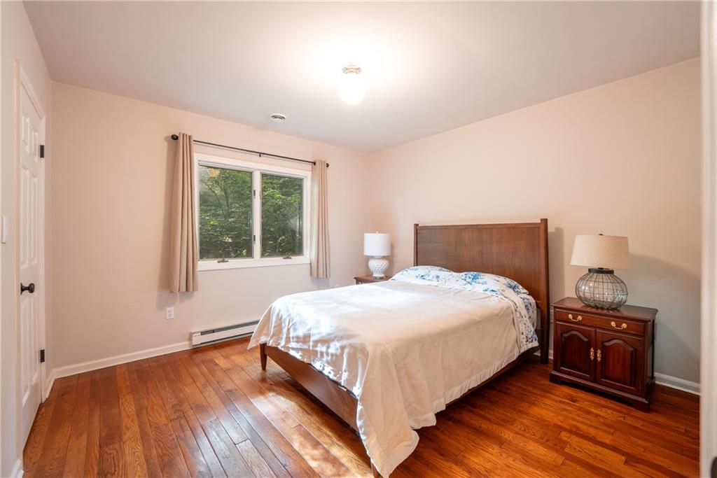 127 Mountain Road Ligonier, PA 15658 - Photo 35 of 45 a bedroom with a bed and a tv