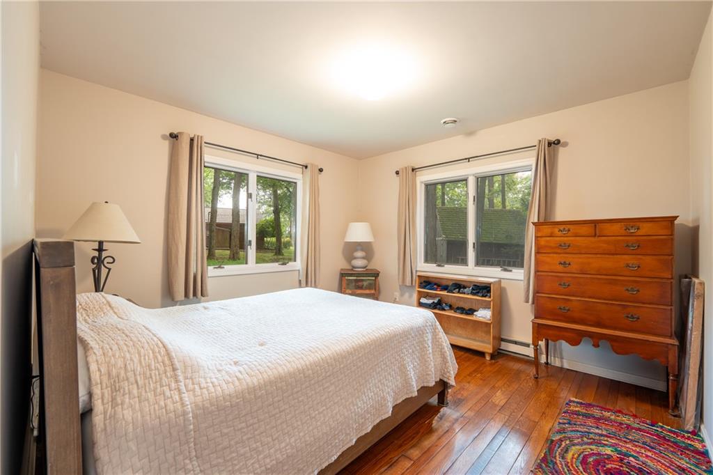 127 Mountain Road Ligonier, PA 15658 - Photo 36 of 45 a bedroom with a bed and wooden floor