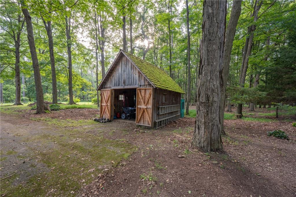 127 Mountain Road Ligonier, PA 15658 - Photo 38 of 45 a view of a house with large trees and a small yard