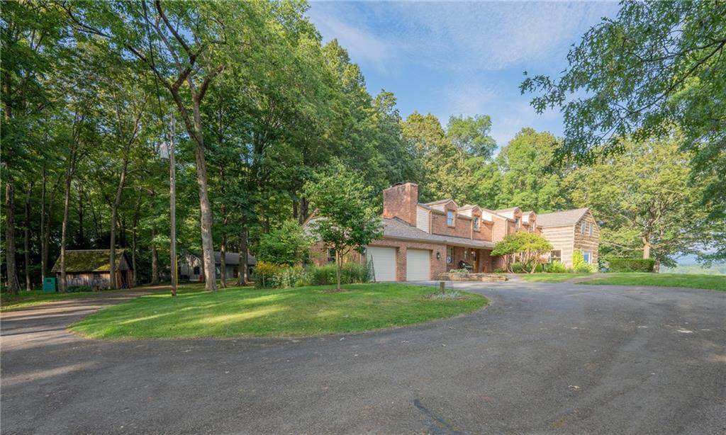 127 Mountain Road Ligonier, PA 15658 - Photo 4 of 45 a front view of a house with a yard