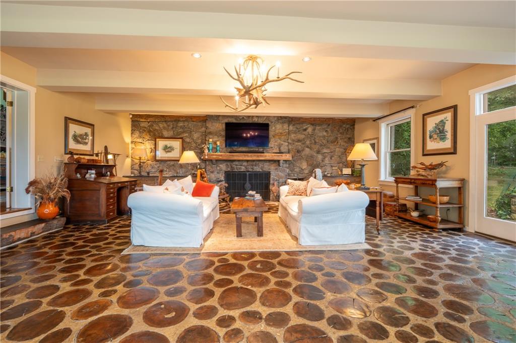 127 Mountain Road Ligonier, PA 15658 - Photo 5 of 45 a living room with furniture a flat screen tv and a fireplace
