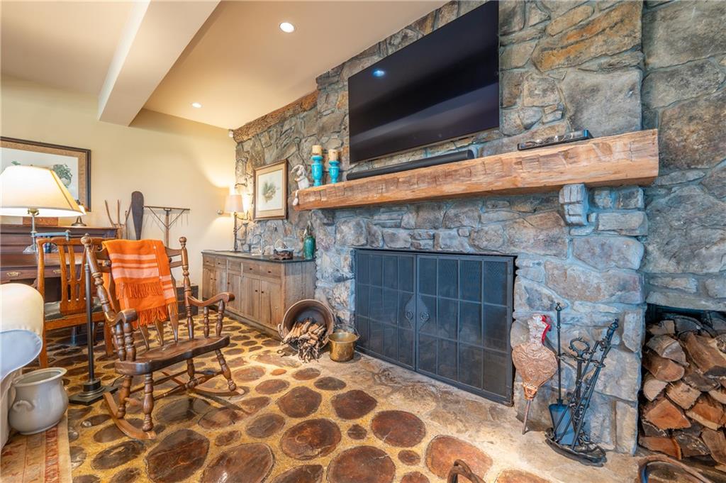 127 Mountain Road Ligonier, PA 15658 - Photo 7 of 45 a living room with patio furniture and a fireplace