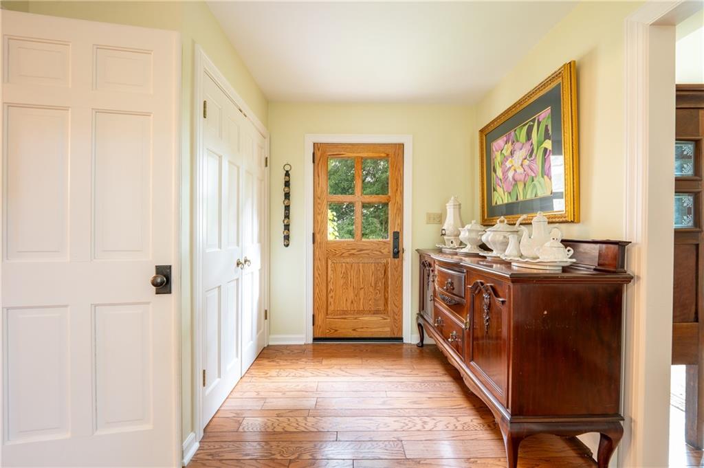 127 Mountain Road Ligonier, PA 15658 - Photo 8 of 45 a bathroom with a double vanity sink a mirror a bathtub and shower