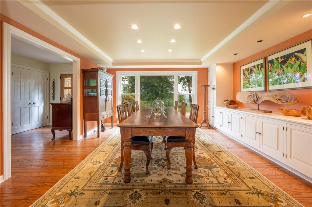 127 Mountain Road Ligonier, PA 15658 - Photo 10 of 45 a dining room with wooden floor and large window