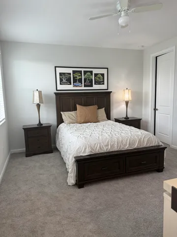 a room with a bed and a night stand