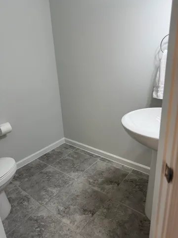 a bathroom with a toilet and a sink