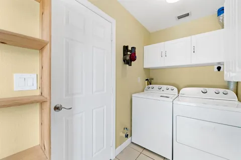 a view of storage and utility room with washer and dryer