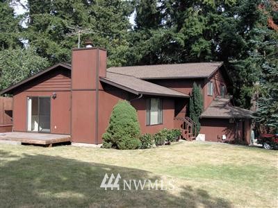 23514 Meridian Avenue South Bothell, WA 98021 - Photo 1 of 1 a front view of a house with a yard