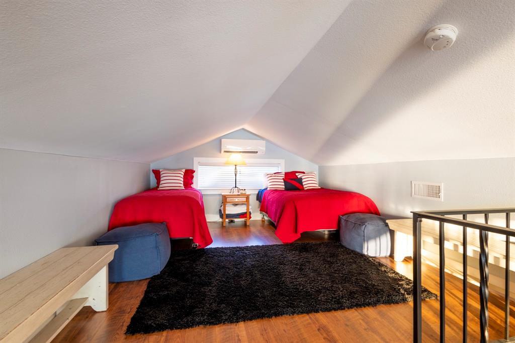 115 Isle Of View Drive Tool, TX 75143 - Photo 15 of 27 a bedroom with two beds and a potted plant