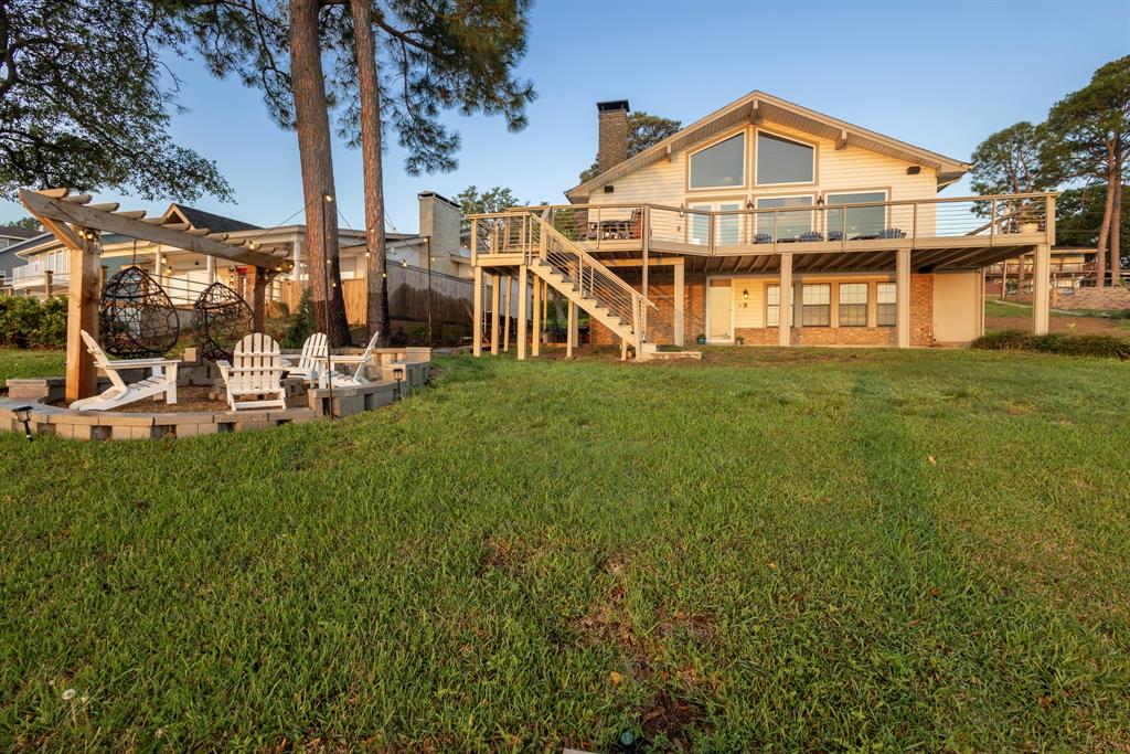 115 Isle Of View Drive Tool, TX 75143 - Photo 3 of 27 a view of a large house with a yard