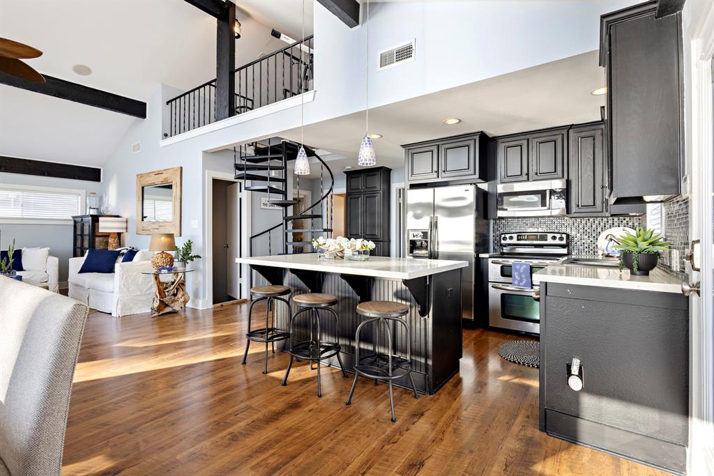 115 Isle Of View Drive Tool, TX 75143 - Photo 6 of 27 a view of dining room kitchen with stainless steel appliances kitchen island granite countertop a table chairs and a living room