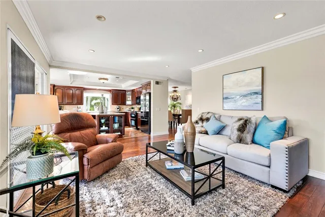 a kitchen with stainless steel appliances kitchen island granite countertop a stove and a sink