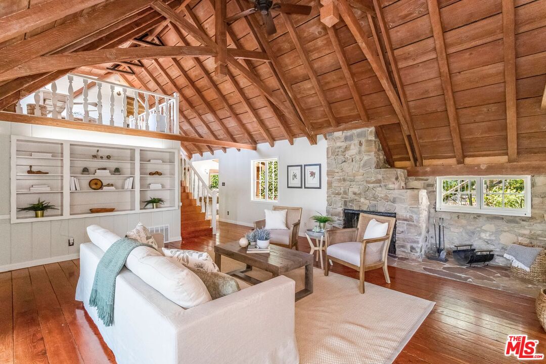 3940 Davana Road Sherman Oaks, CA 91423 - Photo 11 of 60 a living room with furniture and a fireplace