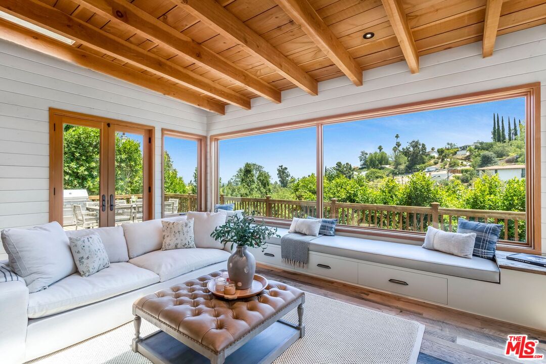 3940 Davana Road Sherman Oaks, CA 91423 - Photo 13 of 60 a living room with patio furniture and a potted plant