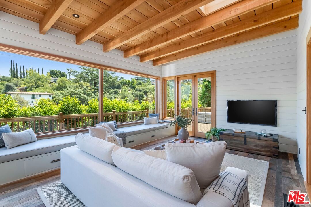 3940 Davana Road Sherman Oaks, CA 91423 - Photo 14 of 60 a living room with furniture and a flat screen tv