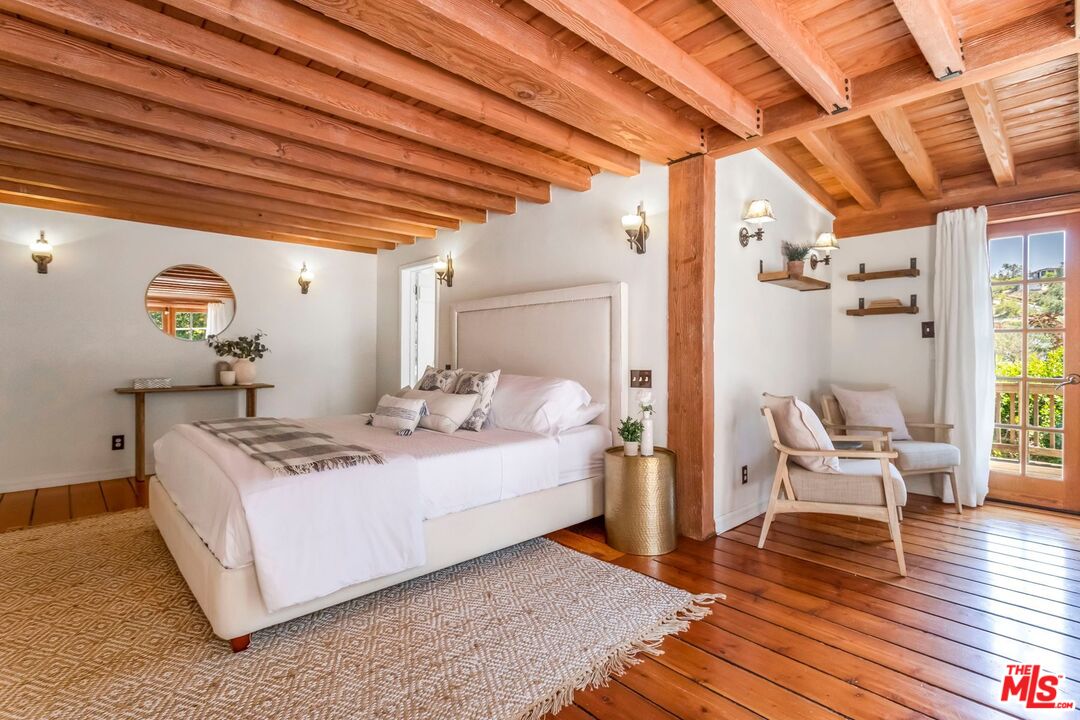 3940 Davana Road Sherman Oaks, CA 91423 - Photo 35 of 60 a bed room with a bed and a chair