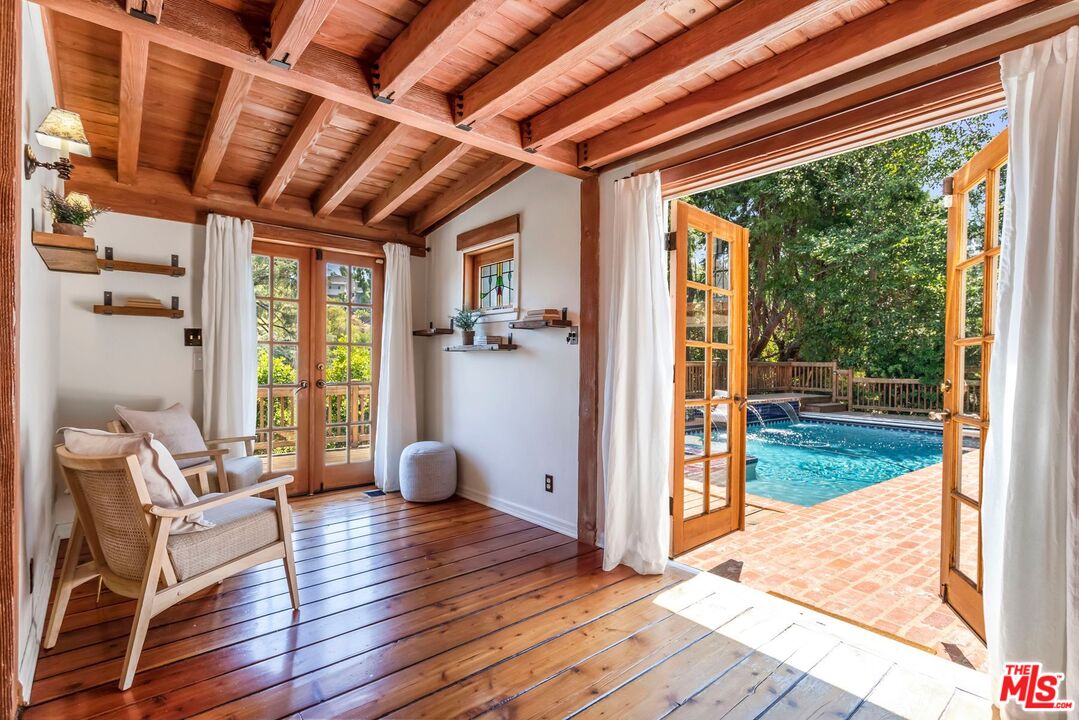 3940 Davana Road Sherman Oaks, CA 91423 - Photo 36 of 60 a view of an entryway with wooden floor and windows
