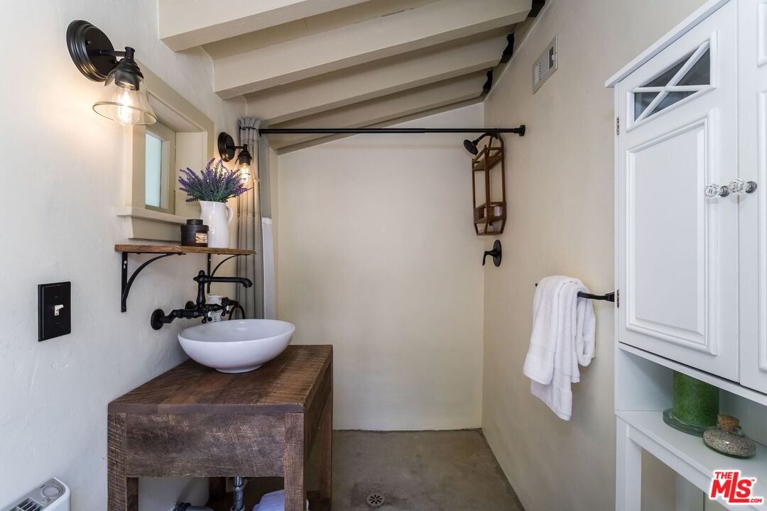 3940 Davana Road Sherman Oaks, CA 91423 - Photo 43 of 60 a bathroom with a sink a toilet and shower