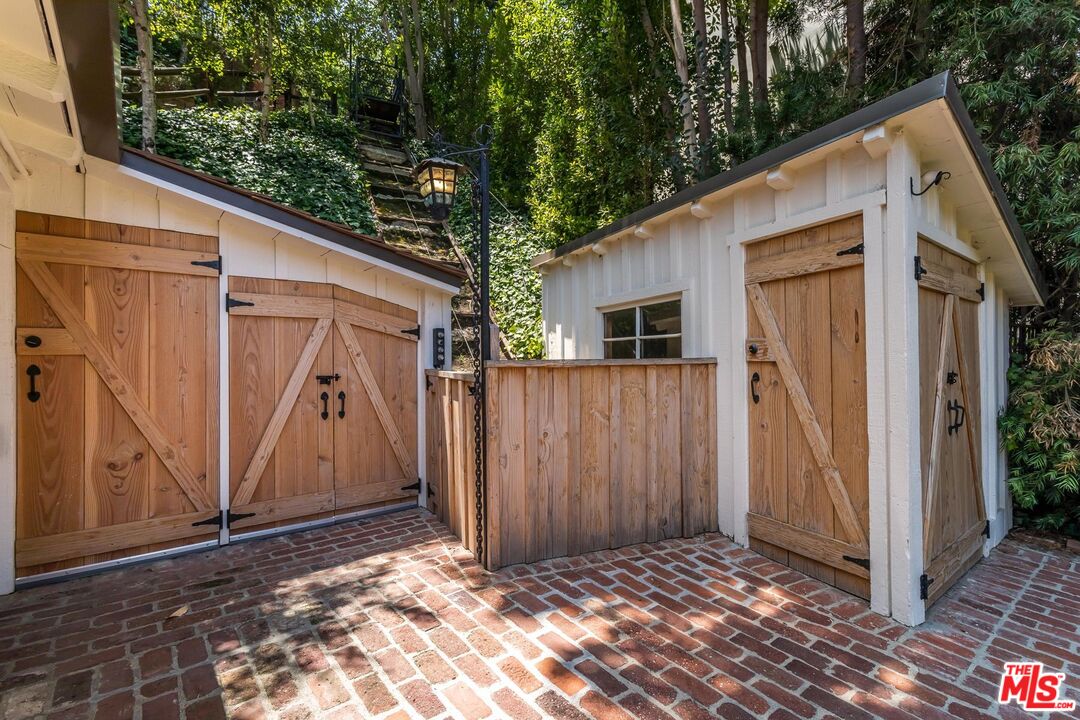 3940 Davana Road Sherman Oaks, CA 91423 - Photo 54 of 60 a view of house with garage and wooden fence