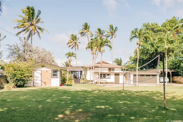 a dining room with furniture a rug and wooden floor
