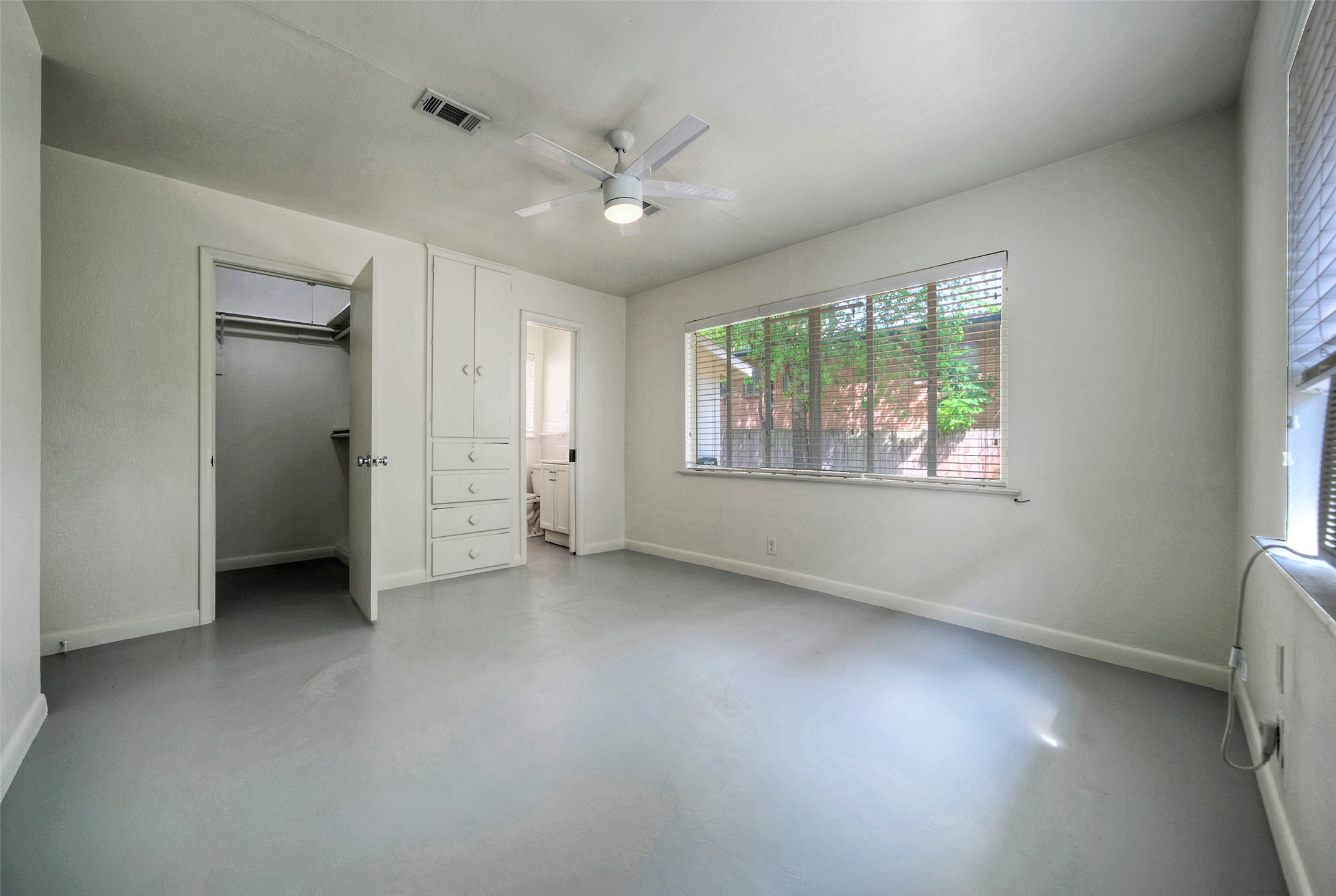 1803 Pearl Street Austin, TX 78701 - Photo 13 of 33 an empty room with windows and closet