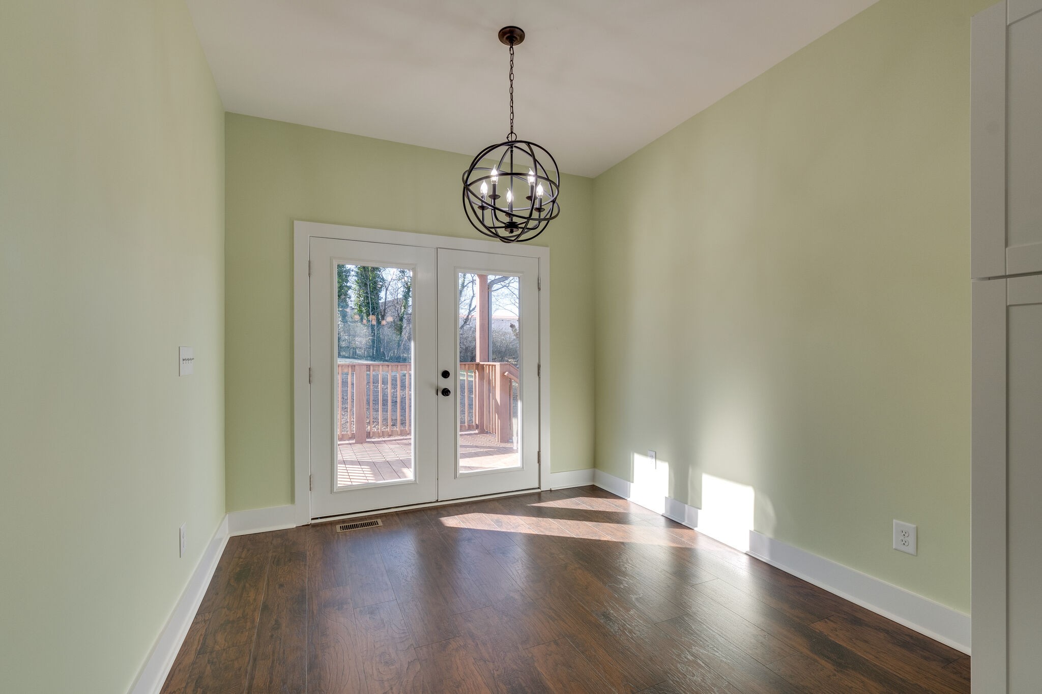 1004 Bridge Street Columbia, TN 38401 - Photo 13 of 25 a view of an empty room with wooden floor and fan